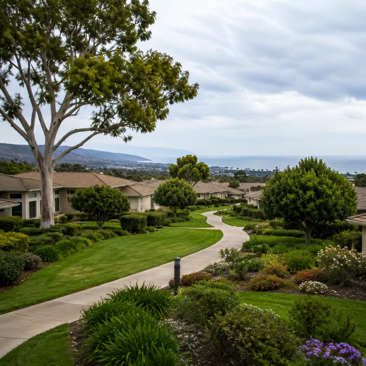 Realistic editorial photo of a Ventura County retirement community with low homes, greenbelt paths, mature trees, and co