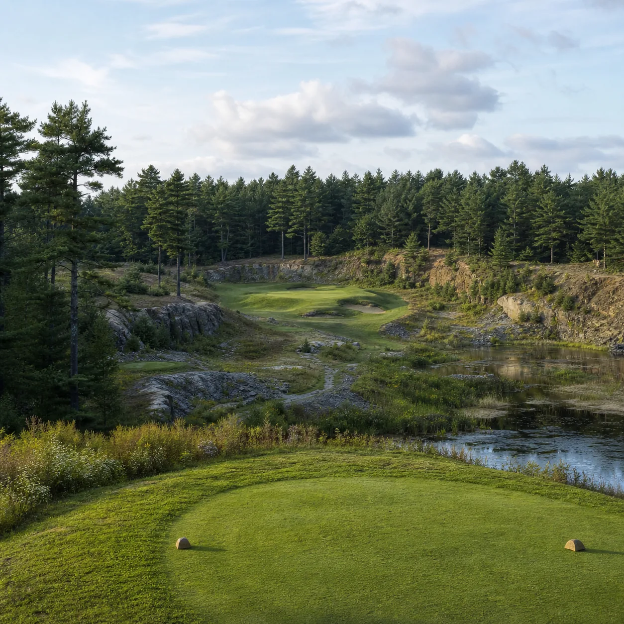 Realistic editorial photo of a Northwoods golf course built through old quarry land with pine forest, wetland edges, rai